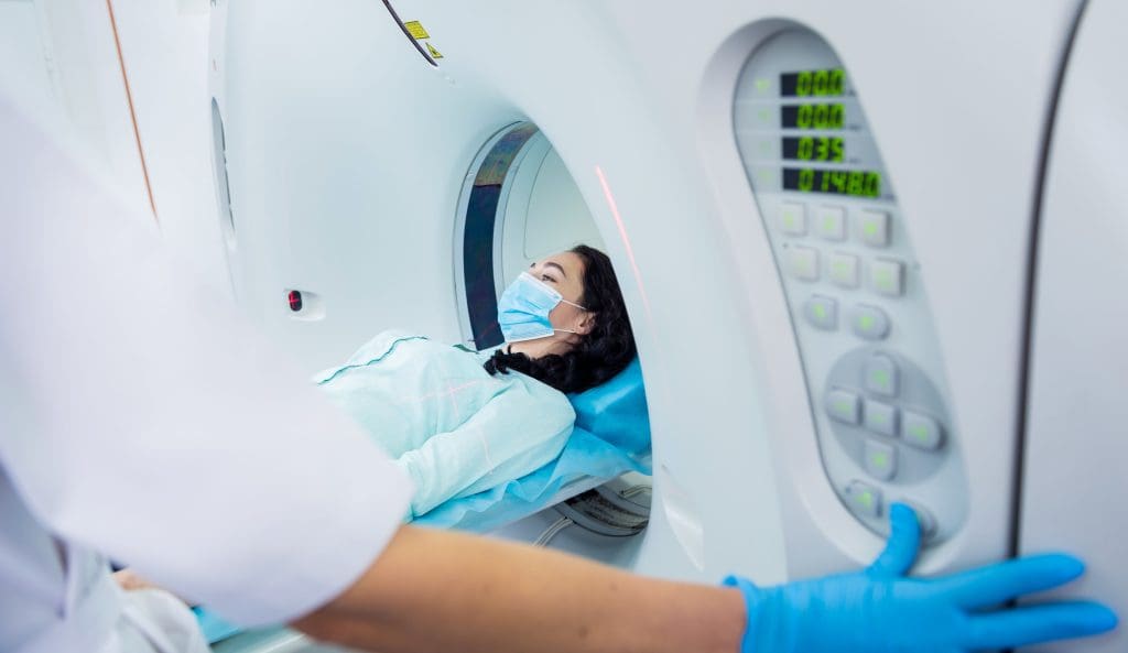 Why can't you be around anyone after a PET scan?