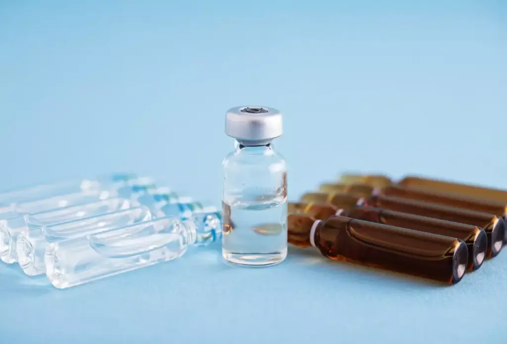 A close-up view of various over-the-counter arthritis medication bottles and containers, such as ibuprofen, acetaminophen, and topical creams, arranged neatly on a wooden or marble surface. The lighting is soft and diffused, highlighting the textures and colors of the products. The background is slightly blurred, creating a sense of focus on the medication. The overall mood is one of calm and thoughtfulness, conveying the importance of accessible over-the-counter options for managing the impact of arthritis.