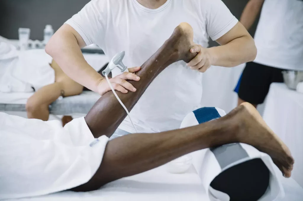 A detailed anatomical cross-section of the human leg, showcasing the location of yellow marrow within the bone structure. The image should be rendered with a clinical, medical illustration style, using a neutral color palette and clear, precise linework. The foreground should prominently display the leg bone, with a cutaway view revealing the yellow marrow cavity. The middle ground should include surrounding muscle and connective tissue for context. The background should be a plain, white studio setting, allowing the subject to be the sole focus. Lighting should be directional and shadowless, creating clean, crisp edges. The overall mood should be informative and educational, suitable for use in a medical reference article.