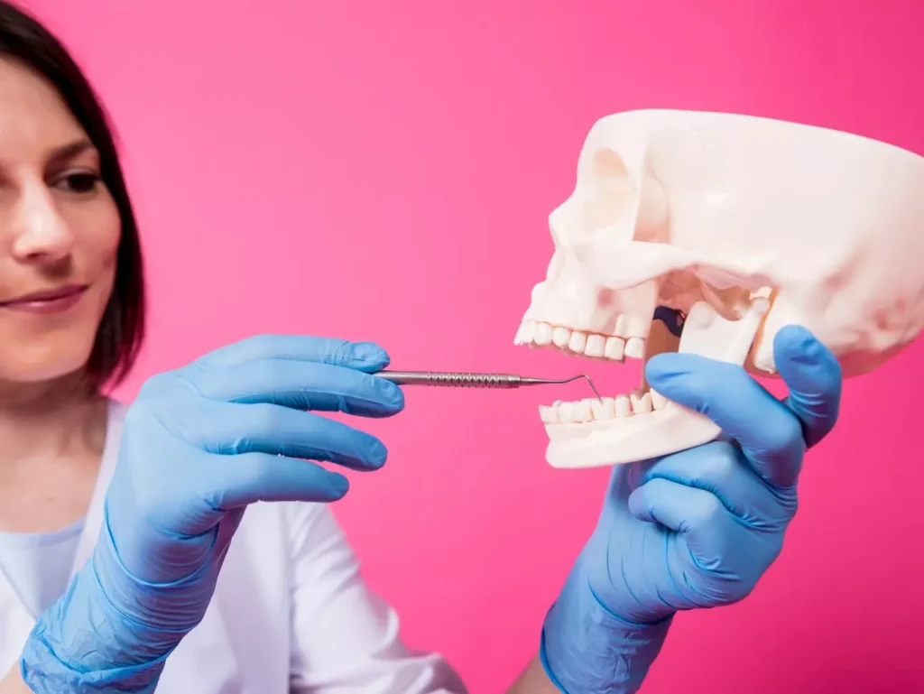 A detailed close-up view of a human jawbone with a missing tooth, showcasing the need for a bone graft procedure. The jawbone appears slightly worn and discolored, indicating a lack of adequate bone density. The scene is illuminated by soft, warm lighting from the side, casting subtle shadows that accentuate the bone's structure and texture. The camera angle is slightly angled, providing a perspective that draws the viewer's attention to the specific area of concern. The background is blurred, keeping the focus on the jawbone and the surgical necessity.