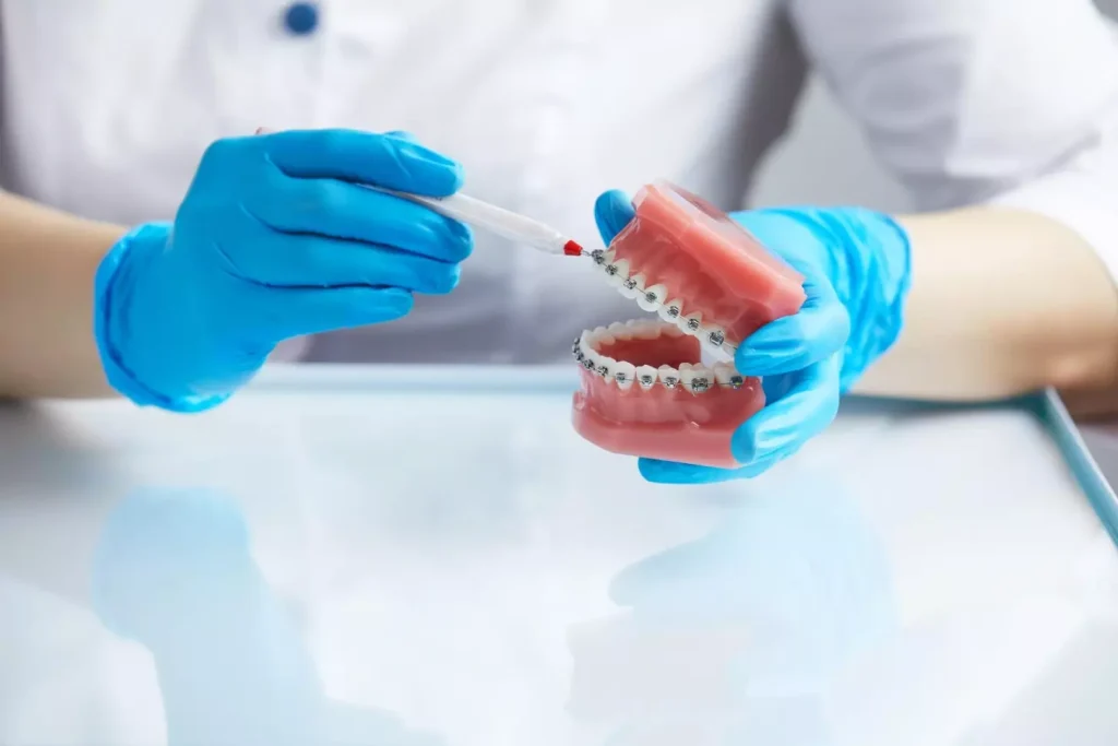 A detailed cross-sectional view of the dental bone implant process. In the foreground, a lifelike dental implant is precisely inserted into the jawbone, revealing the intricate internal structure. The middle ground showcases the bone graft material being carefully packed around the implant, stimulating natural bone growth. In the background, the surrounding healthy teeth and gums are visible, captured with a shallow depth of field for focus on the implant procedure. Warm, natural lighting illuminates the scene, creating a sense of clinical precision and medical expertise. The overall composition conveys the technical complexity and careful steps involved in this specialized dental treatment.