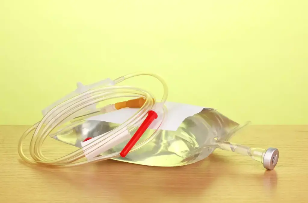 A detailed, high-resolution illustration showcasing common chemotherapy regimens for non-Hodgkin's lymphoma (NHL). In the foreground, various chemotherapy drugs and infusion bags are arranged neatly, their labels clearly visible. In the middle ground, a clinical setting with medical equipment and a patient receiving treatment. The background features a schematic diagram outlining standard NHL chemotherapy protocols, such as R-CHOP, R-CVP, and R-Bendamustine, with concise descriptions. The image is rendered with a clean, clinical aesthetic, using soft, directional lighting to create depth and emphasize the medical elements. The overall tone is informative and educational, providing a comprehensive visual guide to NHL chemotherapy regimens.