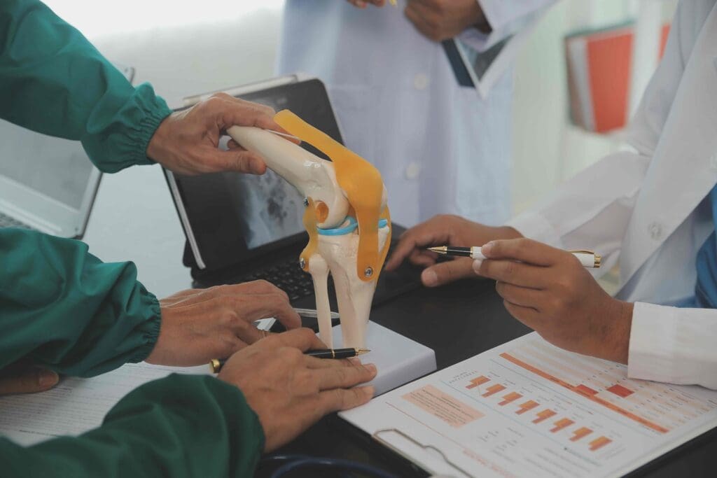A detailed surgical scene depicting a partial knee replacement procedure.