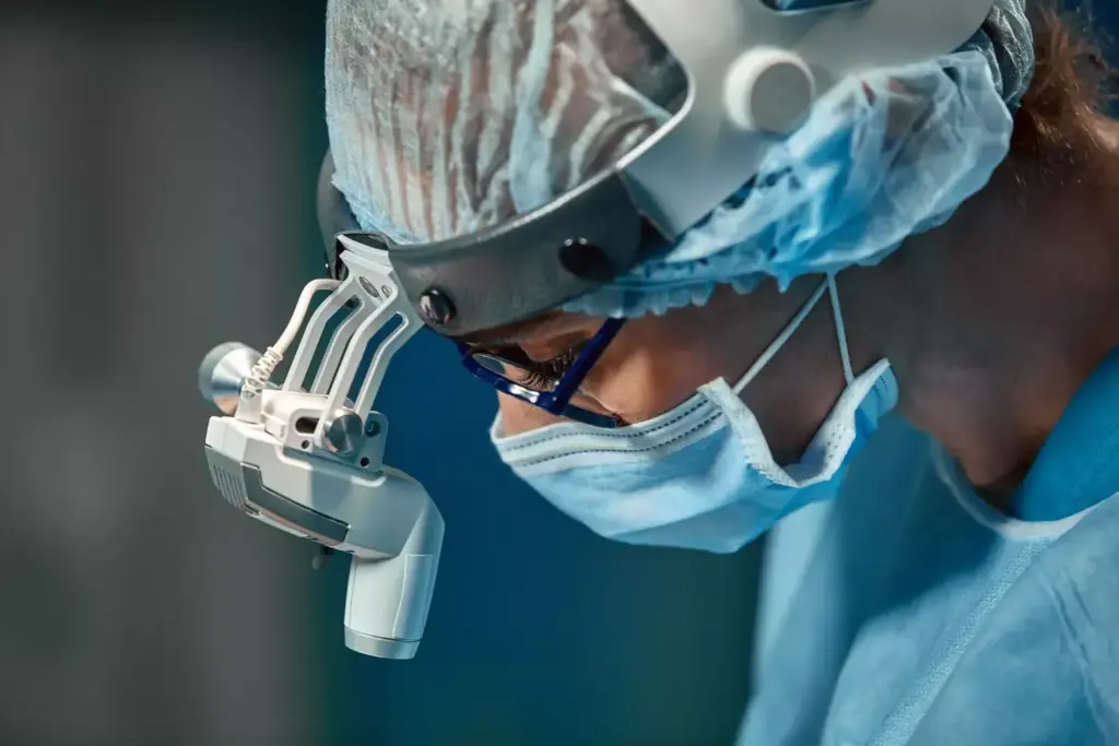 A detailed surgical view of an intricate cervical fusion procedure. In the foreground, a skilled surgeon's hands delicately manipulate the spinal vertebrae, exposing the intricate anatomy. Midground, the patient's neck is exposed, revealing the precise surgical incision and carefully retracted tissue. In the background, the sterile, well-lit operating room setting conveys a sense of clinical precision, with medical equipment and lights casting a warm, focused glow. The composition emphasizes the technical expertise and meticulous care required to perform this specialized orthopedic surgery, intended to alleviate pain and restore mobility.