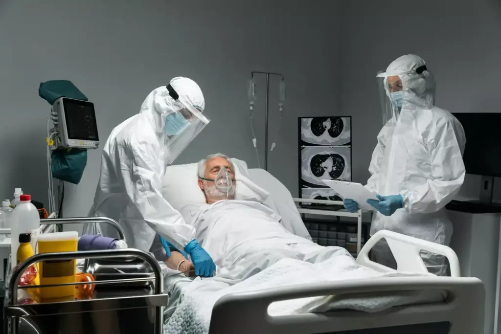 A dimly lit hospital room, the air heavy with the scent of antiseptic. In the foreground, a frail figure lies motionless, tubes and wires snaking from their body, a testament to the relentless march of glioblastoma. The middle ground reveals a worried family gathered, their expressions etched with helplessness and sorrow. The background is a blur of muted colors, suggesting the world outside has faded, leaving only this moment of profound transition. The lighting is somber, casting shadows that accentuate the gravity of the situation, while the camera angle conveys a sense of intimacy and vulnerability. This is the progression toward the end-stage of glioblastoma, a harrowing journey captured in a single, evocative image.