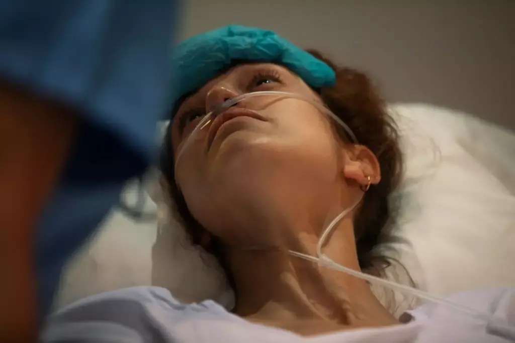 A dimly lit hospital room, the soft glow of medical equipment illuminating a patient lying in bed, their features weathered by the toll of chemotherapy. In the foreground, a tangle of IV lines and medication bottles, conveying the relentless nature of the treatment. The middle ground shows the patient's expression, a mixture of exhaustion and determination, their hand resting on the bedsheet, a symbol of the struggle to find the strength to carry on. The background fades into a hazy blur, suggesting the isolation and introspection that often accompany the fatigue of chemotherapy. The overall atmosphere is one of quiet contemplation, the image capturing the complex emotional and physical experiences of this arduous journey.