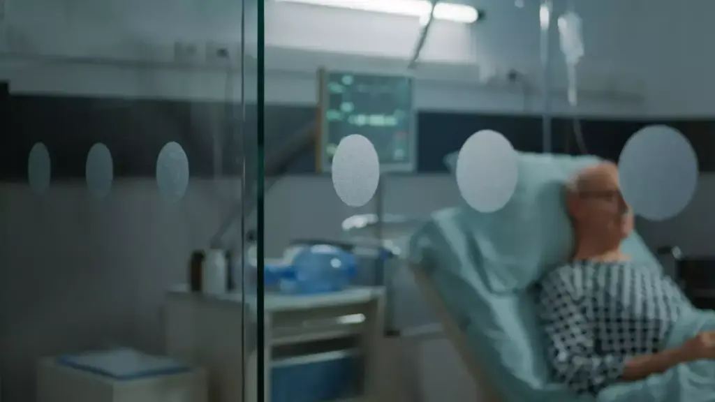 A dimly lit hospital room, the sterile white walls and equipment casting a harsh, clinical glow. In the foreground, a weary patient sits in a chair, their once vibrant complexion now gaunt and pale, the ravages of chemotherapy etched into their features. Tendrils of fatigue and uncertainty radiate from their posture, a tangible reminder of the persistent, lingering effects of the treatment. The background fades into a hazy, dreamlike blur, evoking a sense of the patient's disorientation and the personal struggle they face, even long after the initial treatment has ended.