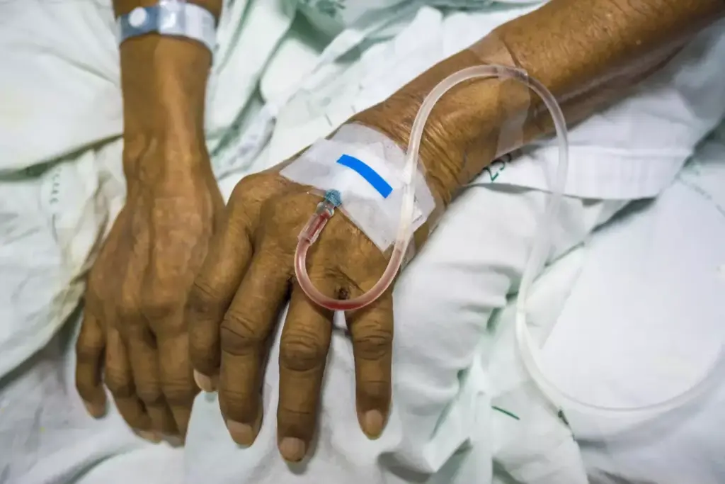 A dimly lit hospital room, the walls painted a calming shade of blue. In the center, a patient rests comfortably, an intravenous line snaking from their arm, delivering life-saving chemotherapy. The infusion pump emits a soft hum, its LED display casting a gentle glow. Nurses, dressed in crisp white uniforms, carefully monitor the treatment, ensuring the delicate balance of medication and fluids. The atmosphere is one of quiet determination, a testament to the critical role of infusion cancer treatment in modern oncology. Soft, diffused lighting illuminates the scene, creating a sense of hope and resilience in the face of a formidable adversary.