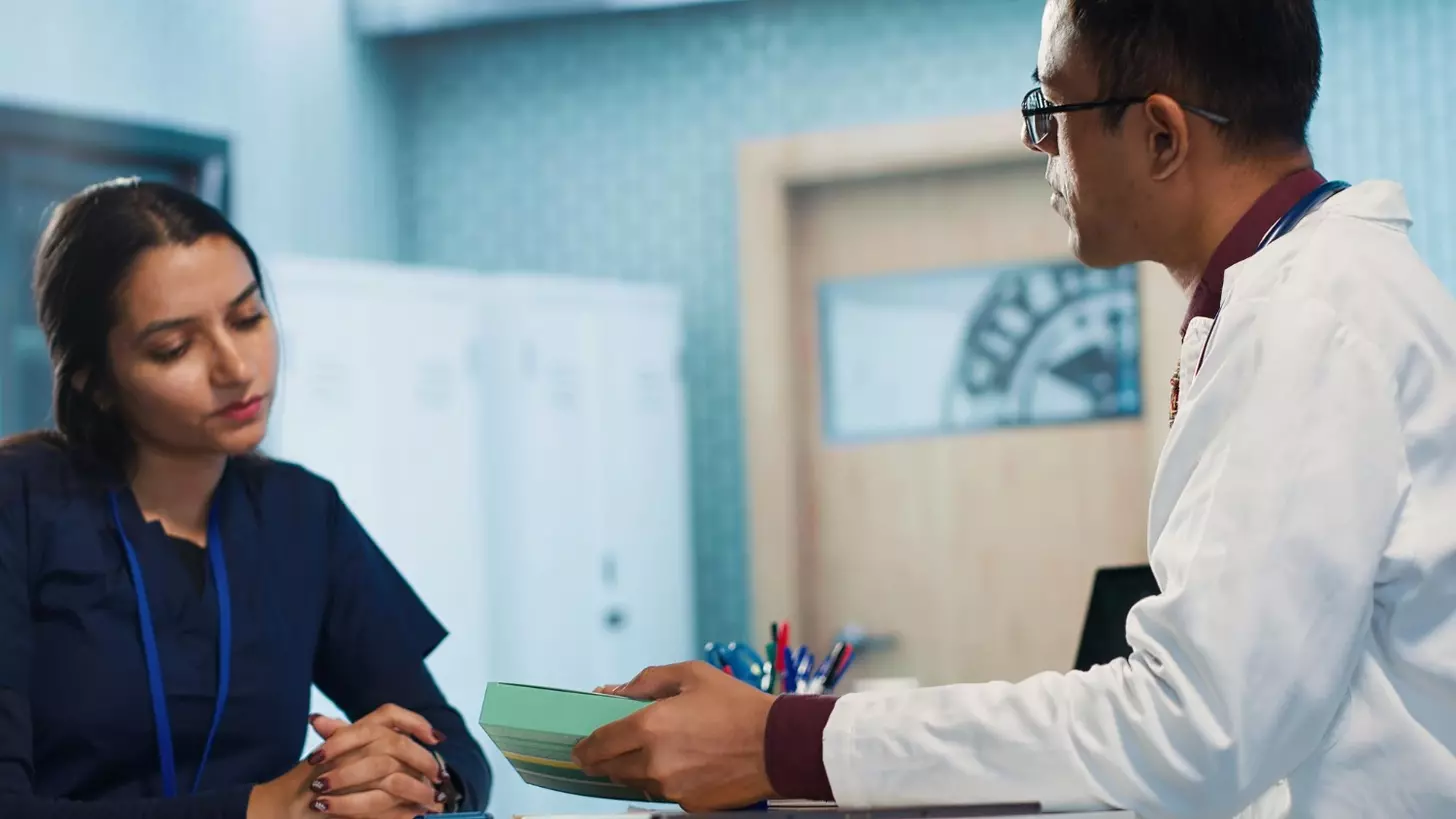 A doctor talking to a patient