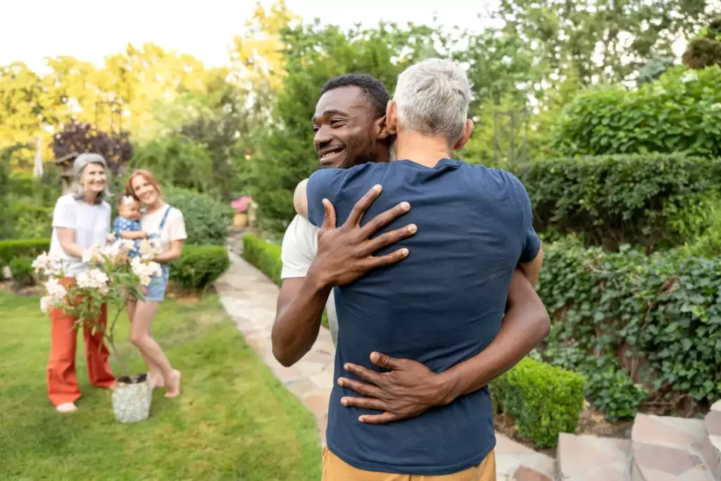 A joyous celebration of the last chemo treatment, captured in a warm and vibrant scene. In the foreground, a person raising their arms triumphantly, surrounded by loved ones embracing and cheering. The middle ground features a beautifully decorated table with a celebratory cake, flowers, and champagne flutes. The background showcases a cozy, intimate setting, perhaps a living room or backyard, bathed in soft, golden lighting that imbues the moment with a sense of hope and new beginnings. The overall atmosphere is one of relief, gratitude, and the excitement of embarking on the next chapter of life, free from the burdens of cancer treatment.