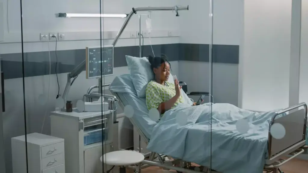 A medical clinic interior, softly lit with warm natural light filtering through windows. In the foreground, a patient rests comfortably on an examination table, her bandaged chest gently rising and falling as she recovers from a recent breast surgery. The surgeon and nurses attend to her, their expressions calm and reassuring. The background features state-of-the-art medical equipment, lending an atmosphere of expertise and care. The overall mood is one of tenderness and healing, conveying the process of recovery after a significant surgical procedure.