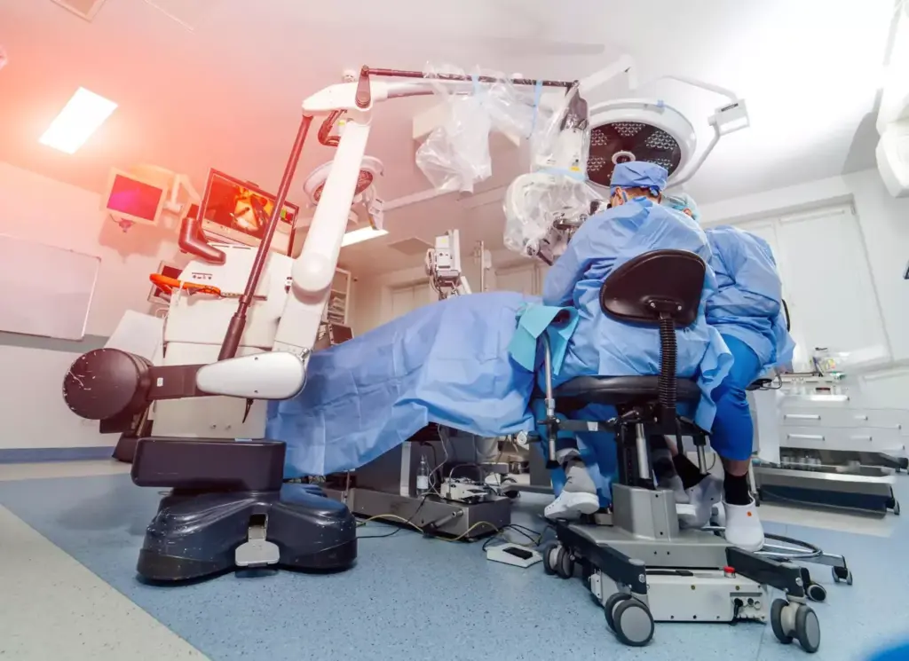 An advanced orthopedic surgical suite, bathed in the warm glow of overhead spotlights. In the foreground, a cutting-edge robotic arm precisely manipulates delicate bone fragments, guided by a surgeon's skilled hands. In the middle ground, state-of-the-art imaging displays reveal intricate skeletal structures, enabling real-time, minimally invasive procedures. The background showcases sleek, modern medical equipment and the crisp, sterile ambiance of a high-tech operating theater, symbolizing the remarkable evolution of orthopedic surgery and its pivotal role in modern healthcare.