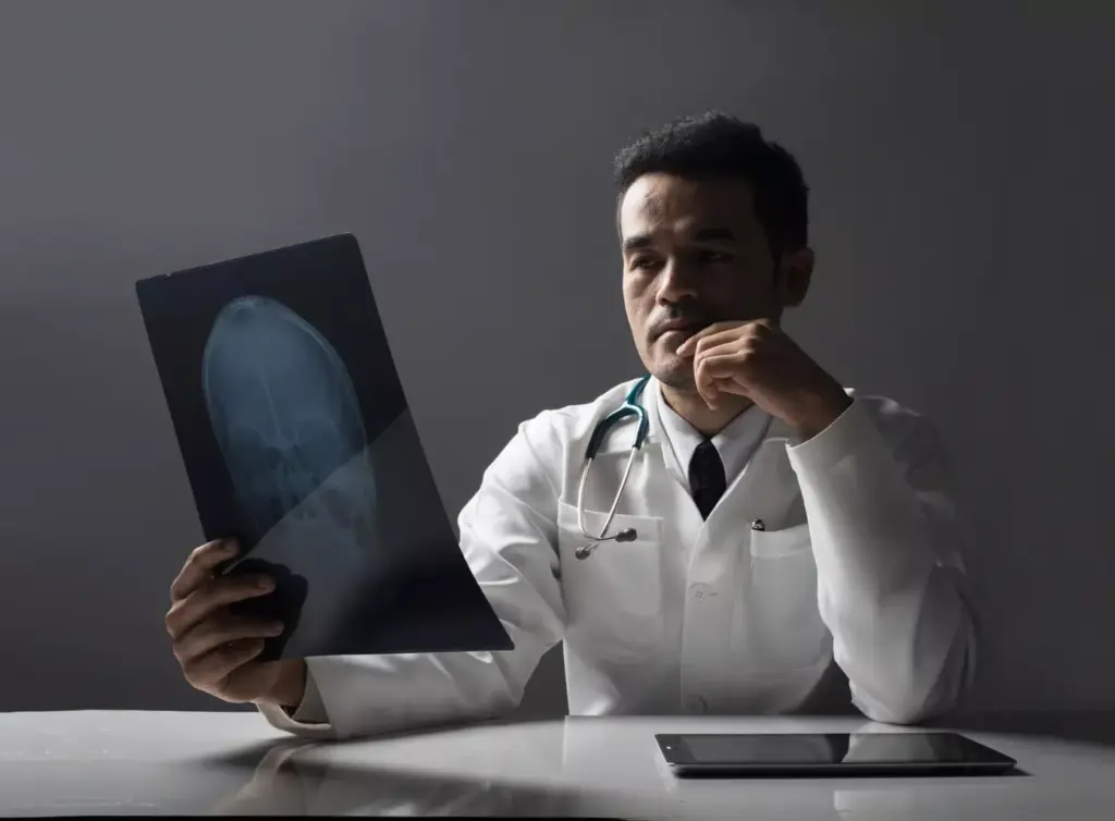 Detailed MRI scan of a brain tumor, showcasing its precise location, size, and morphological features. The image should convey a sense of medical seriousness and clinical analysis, with a crisp, high-resolution depiction of the affected brain region. Utilize a neutral color palette, emphasizing shades of gray, blue, and white to mimic the technical appearance of an actual MRI image. Ensure the tumor is clearly visible, with sharp contrast against the surrounding healthy brain tissue. Capture the image from a slightly elevated, angled perspective to provide a comprehensive view of the affected area. Achieve a balance between technical accuracy and visual clarity to effectively illustrate the critical role of MRI in brain tumor detection.