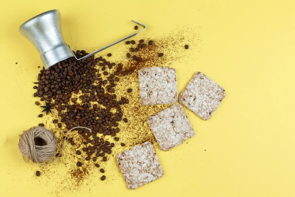 Detailed closeup view of various types of bone graft materials, including demineralized bone matrix, cortical bone chips, and hydroxyapatite granules. The materials are arranged on a clean, neutral background with soft, diffused lighting from multiple angles, showcasing their textural and structural properties. The image has a clinical, scientific feel, emphasizing the medical and dental applications of these bone graft substitutes.