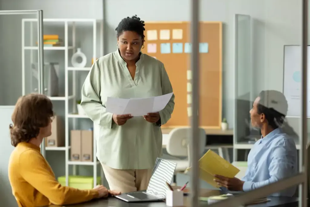 Serene and empowering healthcare setting, soft lighting illuminating a warm, inviting atmosphere. In the foreground, an array of supportive resources - brochures, informational pamphlets, and referral materials neatly organized on a wooden table. In the middle ground, a welcoming nurse or counselor smiling and gesturing towards the resources, conveying a sense of compassionate guidance. The background features soothing, neutral-toned walls, radiating a sense of safety and comfort. The overall scene evokes a comprehensive, patient-centric environment where breast cancer patients and their caregivers can access essential support and information. Serene and empowering healthcare setting, soft lighting illuminating a warm, inviting atmosphere. In the foreground, an array of supportive resources - brochures, informational pamphlets, and referral materials neatly organized on a wooden table. In the middle ground, a welcoming nurse or counselor smiling and gesturing towards the resources, conveying a sense of compassionate guidance. The background features soothing, neutral-toned walls, radiating a sense of safety and comfort. The overall scene evokes a comprehensive, patient-centric environment where breast cancer patients and their caregivers can access essential support and information.