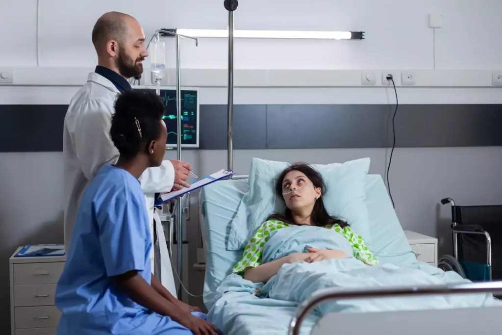 a doctor looking after patient in hospital