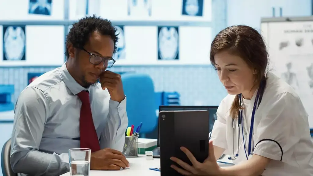 doctor presenting the test findings via scan interpretation on tablet