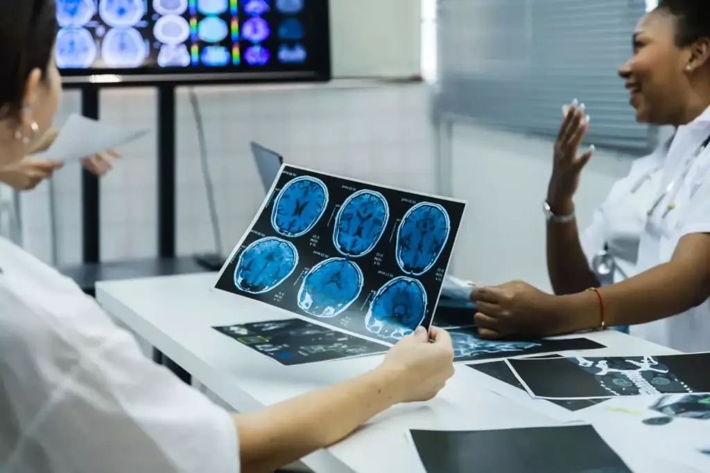 doctors discussing brain scans doctors discussing brain scans