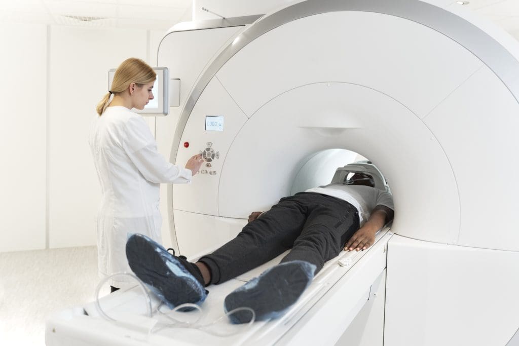 high angle young doctor pressing ct scan buttons 1 1 LIV Hospital