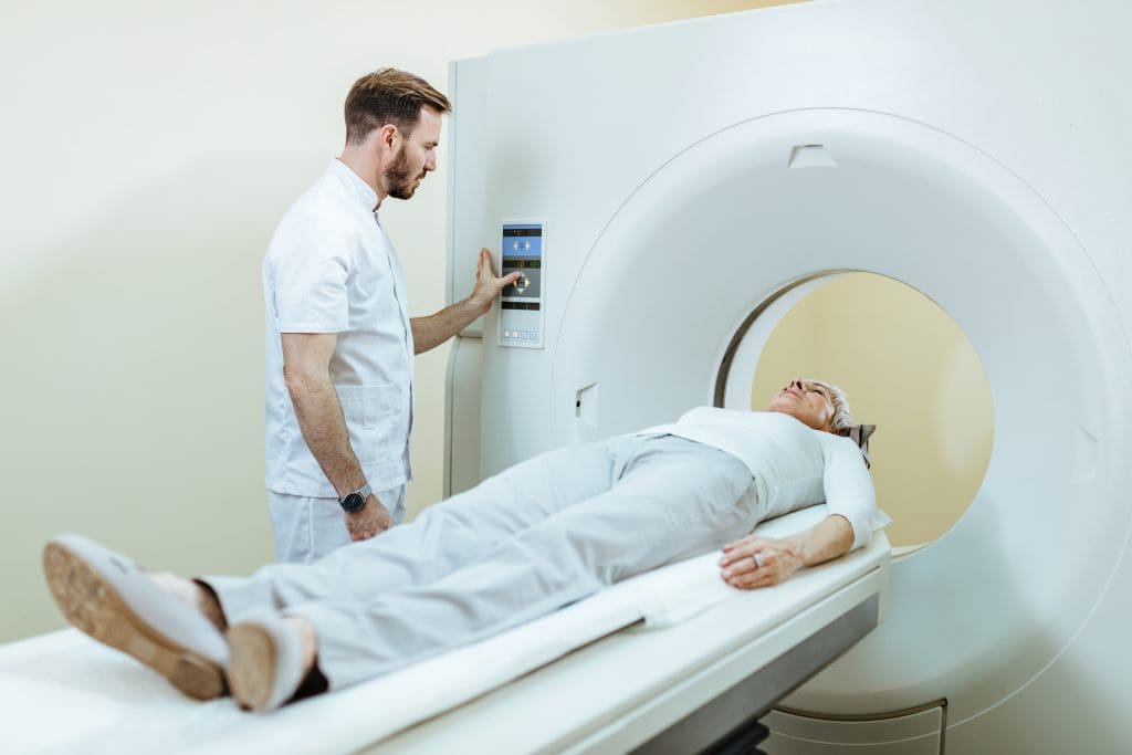 Does a PET Scan Include the Head? Neurological & Whole-Body Coverage 2 medical technician mature patient mri scanning procedure clinic LIV Hospital