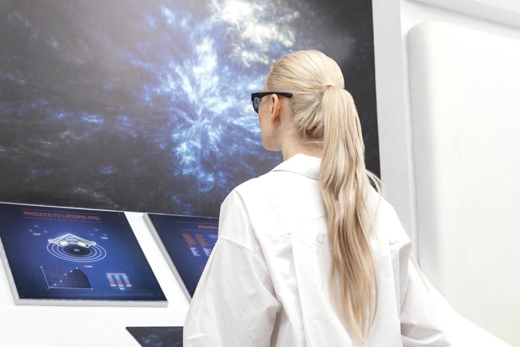 side view woman with digital glasses working monitor 1 LIV Hospital